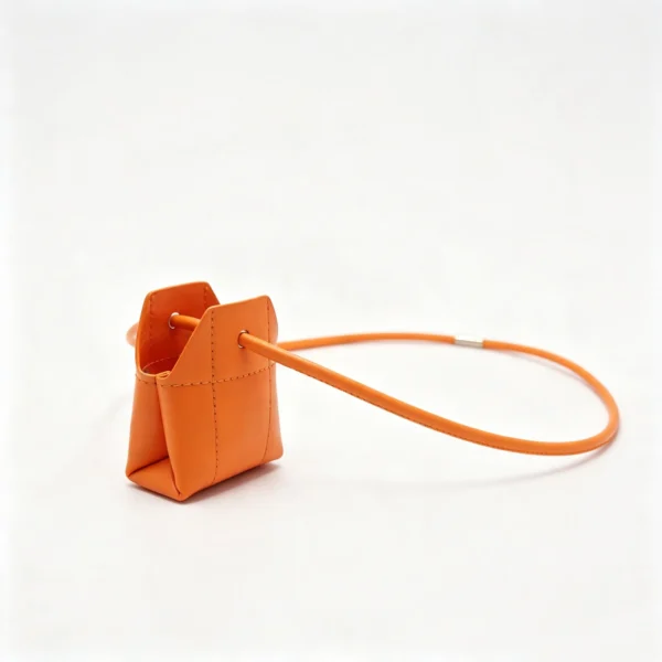 TinyTote orange mini PU leather handbag pouch with top handle TinyTote OEM Mini PU Leather Handbag Pouch with Crossbody Strap