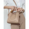 Women Pebbled Leather Decorative Metal Knot Bucket Tote Bag